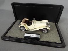 Franklin Mint - A boxed 1:24 scale Jaguar SS by Franklin Mint.