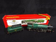 Hornby - A boxed OO gauge Hornby R065 2-10-0 Standard Class 9F steam locomotive and tender Op.No.