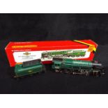 Hornby - A boxed OO gauge Hornby R065 2-10-0 Standard Class 9F steam locomotive and tender Op.No.