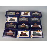 Bachmann - 12 boxed items of OO gauge freight rolling stock by Bachmann.