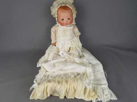 Armand Marseille - a ceramic faced Armand Marseille doll with jointed composition arms and legs,
