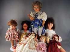 A collection of eight unboxed vintage dolls.