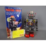 Horikawa (SH Toys) Japan - A boxed tinplate battery operated 'Fighting Robot' by Horikawa of Japan.