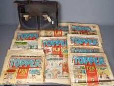 A collection of vintage 'Topper' comics dating from the 1970's presented within a vintage school