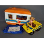 Pedigree - An unboxed vintage Sindy caravan and buggy by Pedigree with an an unmarked naked doll.