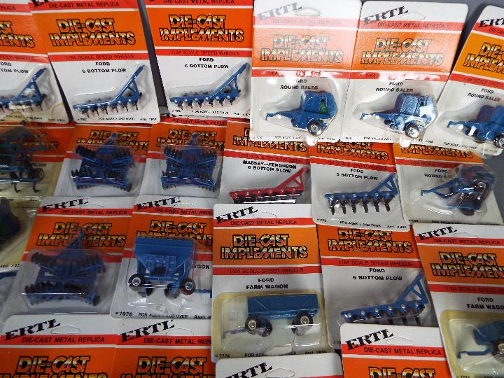 ERTL - Over 40 diecast 1:64 scale carded model farm implements. - Image 3 of 3