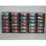 Onyx - 30 boxed diecast F1 racing car models by Onyx.