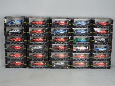 Onyx - 30 boxed diecast F1 racing car models by Onyx.