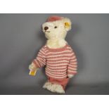 Steiff - An unboxed Steiff Classic teddy bear in white mohair with yellow tag #027567,