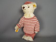 Steiff - An unboxed Steiff Classic teddy bear in white mohair with yellow tag #027567,