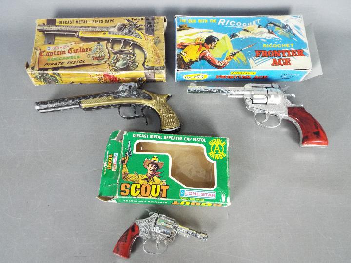 Lone Star, Crescent, Cap Guns - A collection of three boxed vintage toy cap guns.