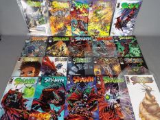 Image - A collection of 'Spawn' modern age comics some of which are contained within in clear