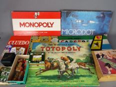 Escalado, Waddingtons, Parker, Others - An assortment of vintage children's games and toys.