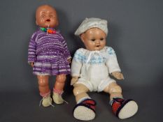 Hugo Wiegand, Kader - Two German made dolls.