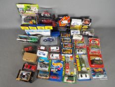A collection of over 30 boxed / carded predominately 1:64 scale and similar diecast vehicles.