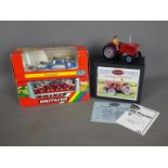 Britains - A collection of boxed farm implements by Britains.