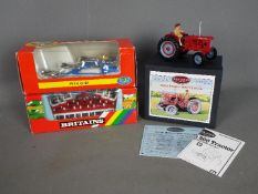 Britains - A collection of boxed farm implements by Britains.