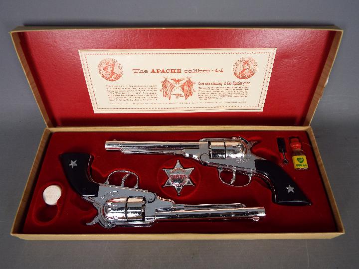 BCM (Derby), Cap Guns - A vintage boxed 'Outlaw Guns' toy cap gun set by BCM.