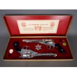 BCM (Derby), Cap Guns - A vintage boxed 'Outlaw Guns' toy cap gun set by BCM.