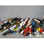 Corgi, Bburago, Dinky, Others - A large quantity of unboxed diecast vehicles in several scales.