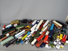 Corgi, Bburago, Dinky, Others - A large quantity of unboxed diecast vehicles in several scales.