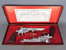 Crescent, Cap Guns - A vintage boxed 'Crescent Matching Pair' of 'Texan Pistols' toy cap guns.