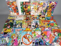Marvel - A library of 25 Marvel modern age comics some of which are contained within in clear