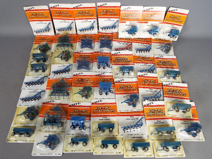 ERTL - Over 40 diecast 1:64 scale carded model farm implements.