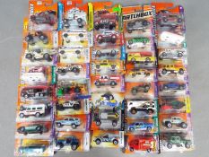 Matchbox - Approximately 40 blister carded modern issue Matchbox diecast vehicles.