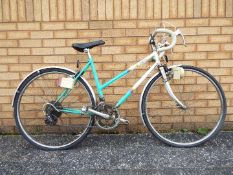 Raleigh - A vintage ladies Raleigh Impulse 12-speed bicycle with steel frame,