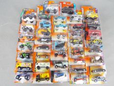 Matchbox - Approximately 40 blister carded modern issue Matchbox diecast vehicles.