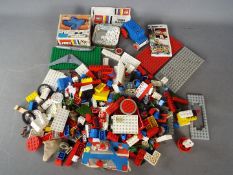 Lego - A plastic tub containing a boxed vintage Lego #101 4.