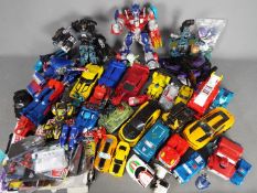 A large quantity of Transformers toys, play worn,