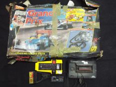 Lot to include a Tyco Racing Grand Prix set, unchecked for completeness, contained in original,