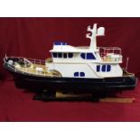 A 'Grand Banks' radio controlled luxury model yacht.