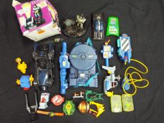 A Ghostbusters Proton Pack playset, Batman vehicles and talking alarm clock,