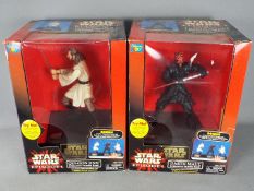 Star Wars, Thinkway Toys - Two boxed Star Wars Interactive Talking Banks by Thinkway Toys.