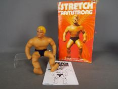 Denys Fisher - A vintage boxed 'Stretch Armstrong' by Denys Fisher.
