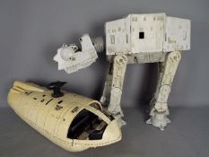 Star Wars - A vintage Imperial AT-AT by Kenner (unboxed) and a Rebel Transport ship.