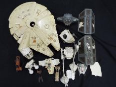 Star Wars - A collection of vintage Star Wars vehicles to include Millennium Falcon, AT-ST,