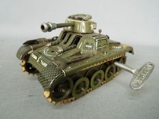 Gama - A vintage tinplate clockwork 'T65' Tank by Gama.