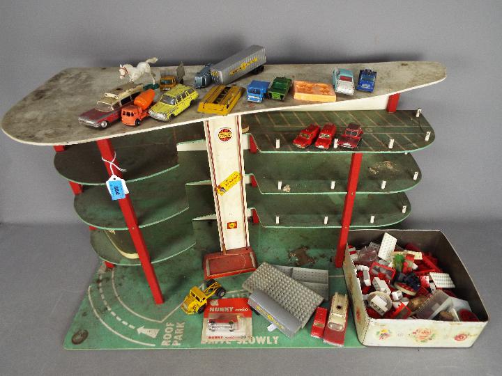 Lego, Dinky Toys, Husky, Corgi - A vintage unboxed and unmarked three storey toy car park / garage,