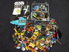 A mixed lot of toys, action figures and accessories to include MASK,