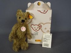 Steiff - A boxed Steiff bear # 002939 'Big Foot Bear', yellow tag,