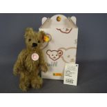 Steiff - A boxed Steiff bear # 002939 'Big Foot Bear', yellow tag,