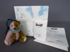 Steiff - A boxed Steiff Mini Bear # 034510 'Harlequin', white tag,