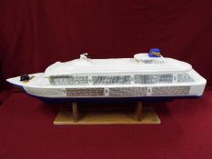 A large plastic model of a cruise ship 'Joshie'.