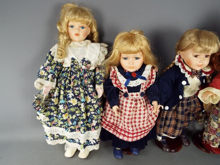 4 Collectable painted dolls with glass eyes (3 on stands). - Image 2 of 7