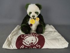 Charlie Bears - A Charlie Bears soft toy teddy bear in the form of a panda, # CB614989 'Mistletoe',