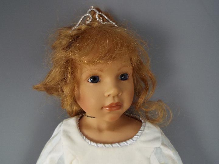 A good quality vinyl dressed doll modelled as a young girl, wearing tiara and necklace, - Image 2 of 5
